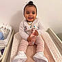 Malya a rejoint le concours — aidez-le/la à gagner de superbes lots ! accessories, baby, clothing, crib, face, footwear, furniture, happy, head, infantbed, jewelry, necklace, pants, person, racket, shoe, sitting, sleeve, smile, sport