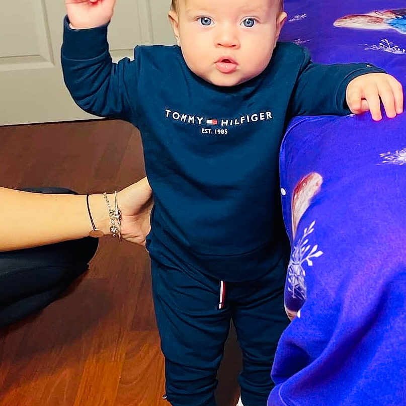 Joseph is registered to the contest to win money with this photo: blonde, bodypart, boy, child, clothing, face, finger, hair, hand, hardwood, head, indoors, interiordesign, male, pants, person, photography, portrait, sleeve, wood