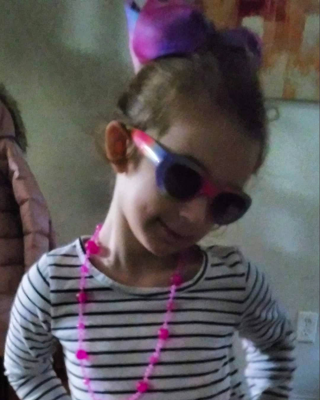 Adriana joined the competition — help win amazing prizes! blond, child, chin, cool, ear, eyewear, fun, glasses, goggles, long_hair, magenta, mouth, neck, person, personal_protective_equipment, pink, plant, sleeve, sunglasses, t_shirt