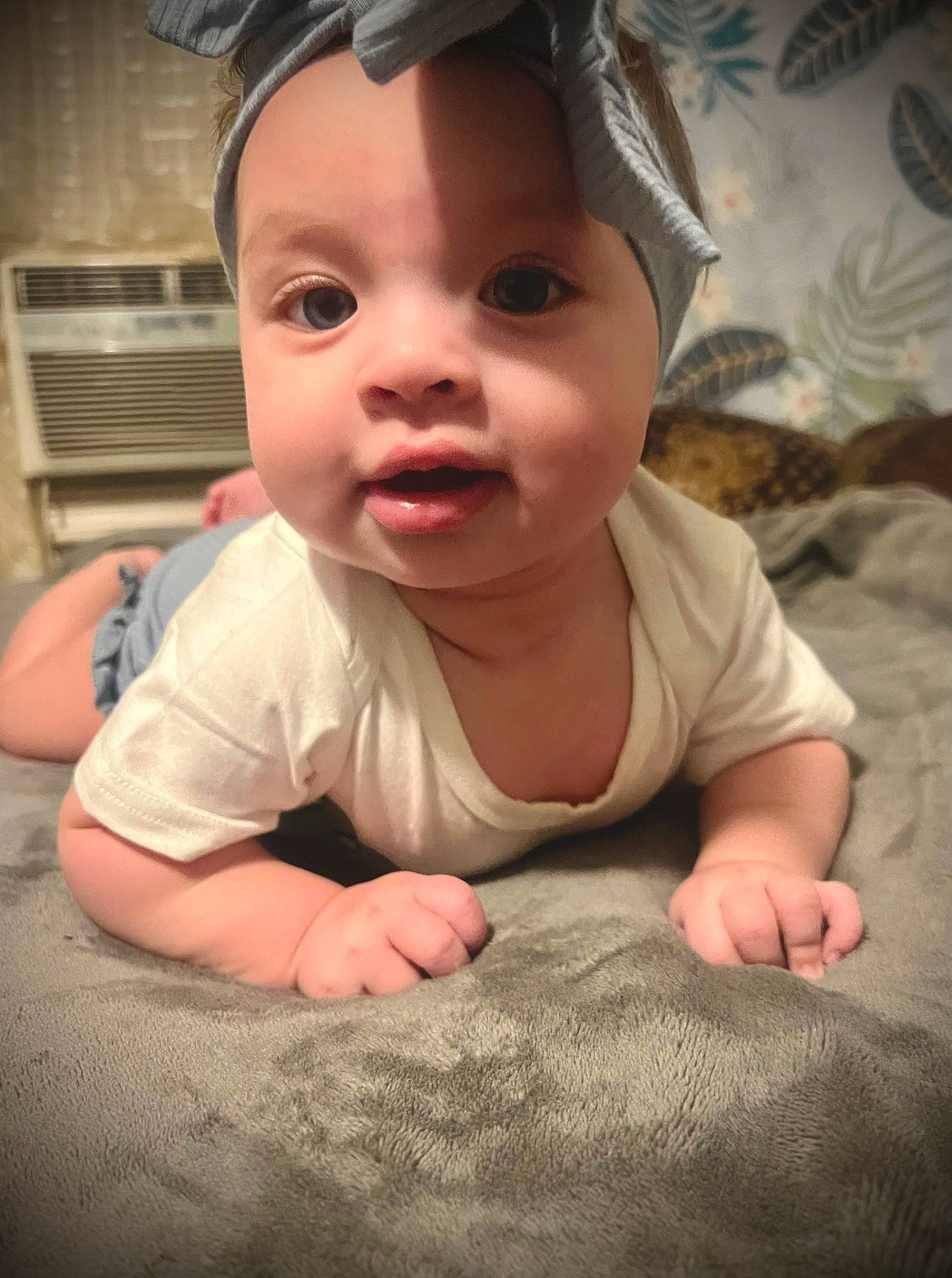 Amirah is registered to the contest to win money with this photo: baby, baby_toddler_clothing, cheek, chin, comfort, eyebrow, eyelash, finger, flash_photography, flooring, fun, happy, iris, linens, mouth, nose, person, skin, sleeve, thumb