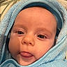 Corvus joined the competition — help win amazing prizes! baby, face, tongue, blue_towel, close_up, cute, child, infant, skin, eyes, eyelashes, expression, soft_texture, wrapped, hooded_towel, portrait, indoors, warm, person, playful