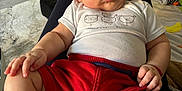 George joined the competition — help win amazing prizes! baby, bodypart, clothing, couch, cushion, face, finger, footwear, furniture, hand, head, homedecor, hosiery, person, photography, portrait, shorts, sitting, sock, t_shirt