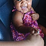 Mileyah joined the competition — help win amazing prizes! baby, child, smiling, happy, purple_dress, holding_hands, seat, leather_seat, person, skin, joy, cute, infant, portrait, indoor, hand, expressive_face, cheerful, human, toddler