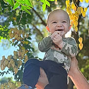 Angelo joined the competition — help win amazing prizes! baby, child, smiling, outdoor, sunlight, green_leaves, yellow_leaves, tree, nature, happy, person, holding_hands, footwear, pants, long_sleeve_shirt, daylight, portrait, cute, joy, background_blur