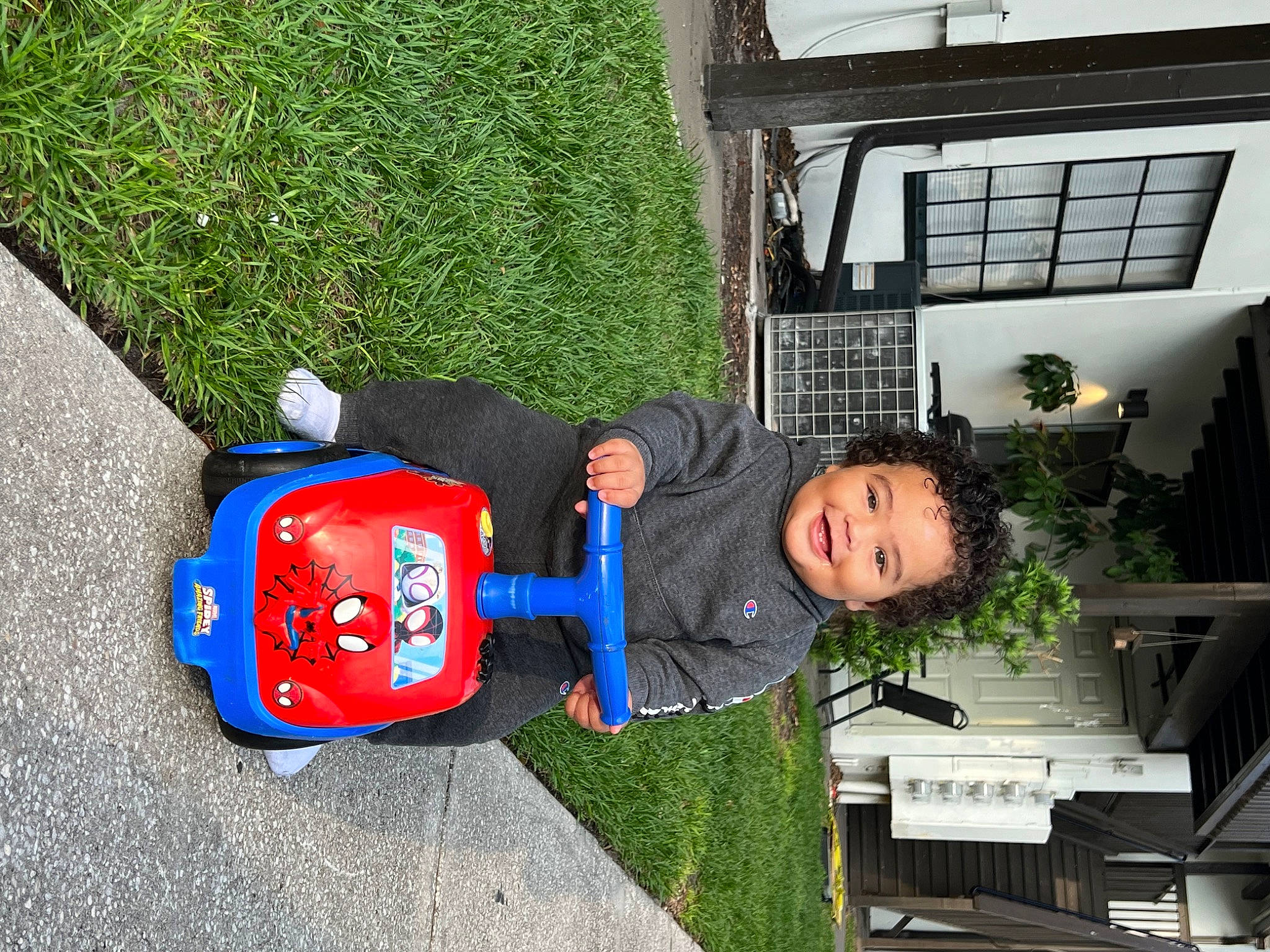 Dior is registered to the contest to win money with this photo: baby, building, child, electric_blue, flooring, fun, grass, house, houseplant, joy, leisure, person, plant, play, recreation, smile, toddler, travel, tree, window