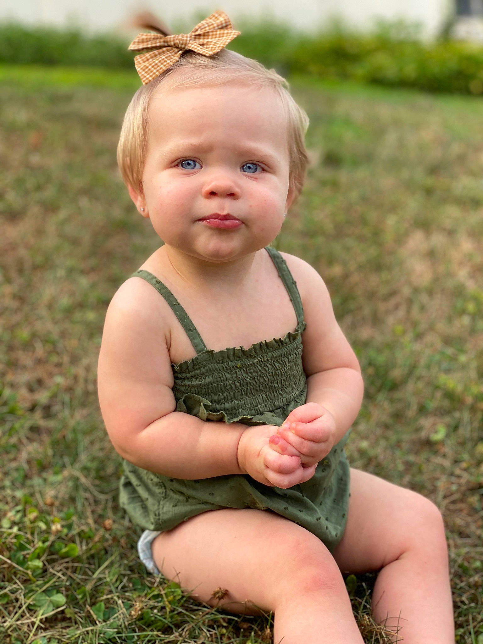 Everly Grace is registered to the contest to win money with this photo: baby, baby_toddler_clothing, blond, child, child_model, design, finger, grass, green, hand, head, leg, pattern, people_in_nature, person, photography, plant, sitting, skin, summer