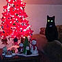 black_cat, christmas_tree, red_tree, ornaments, lights, couch, table, penguin_decorations, snowman_decorations, holiday_decor, indoor, festive, glowing_eyes, dark, shadow, wooden_table, living_room, holiday_season, decorations, pets