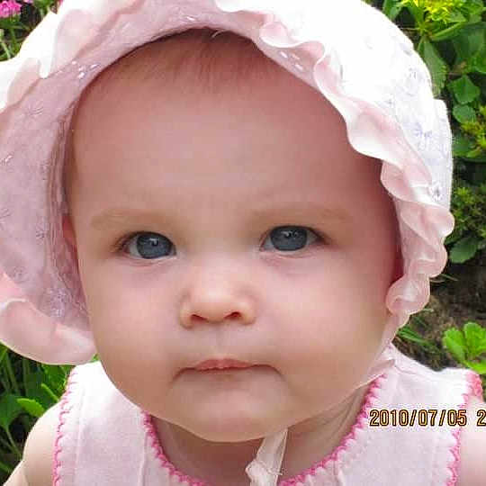 Kiriana joined the competition — help win amazing prizes! baby, child, infant, face, hat, pink, outdoor, garden, greenery, plants, portrait, cute, young, summer, sunhat, closeup, expression, blue_eyes, nature, serious