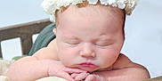 Josephine joined the competition — help win amazing prizes! baby, newborn, sleeping, flower_crown, headband, crib, blanket, wooden_bed, infant, hands, portrait, closeup, soft_light, peaceful, cute, studio_shot, skin, cozy, nursery, delicate