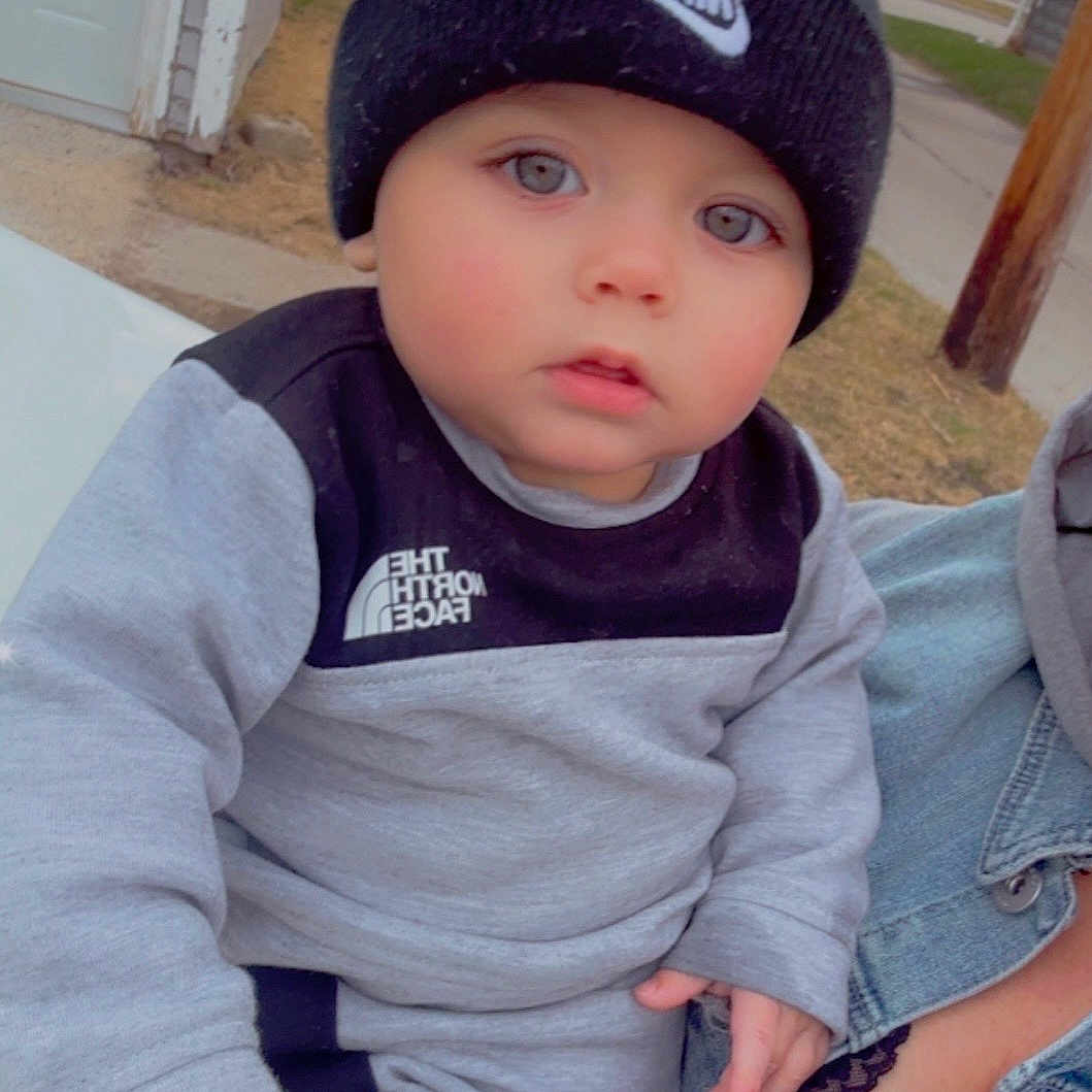 Liam joined the competition — help win amazing prizes! baby, baseballcap, beanie, bonnet, cap, clothing, coat, face, hat, head, hoodie, jacket, jeans, knitwear, pants, person, photography, portrait, sweater, sweatshirt