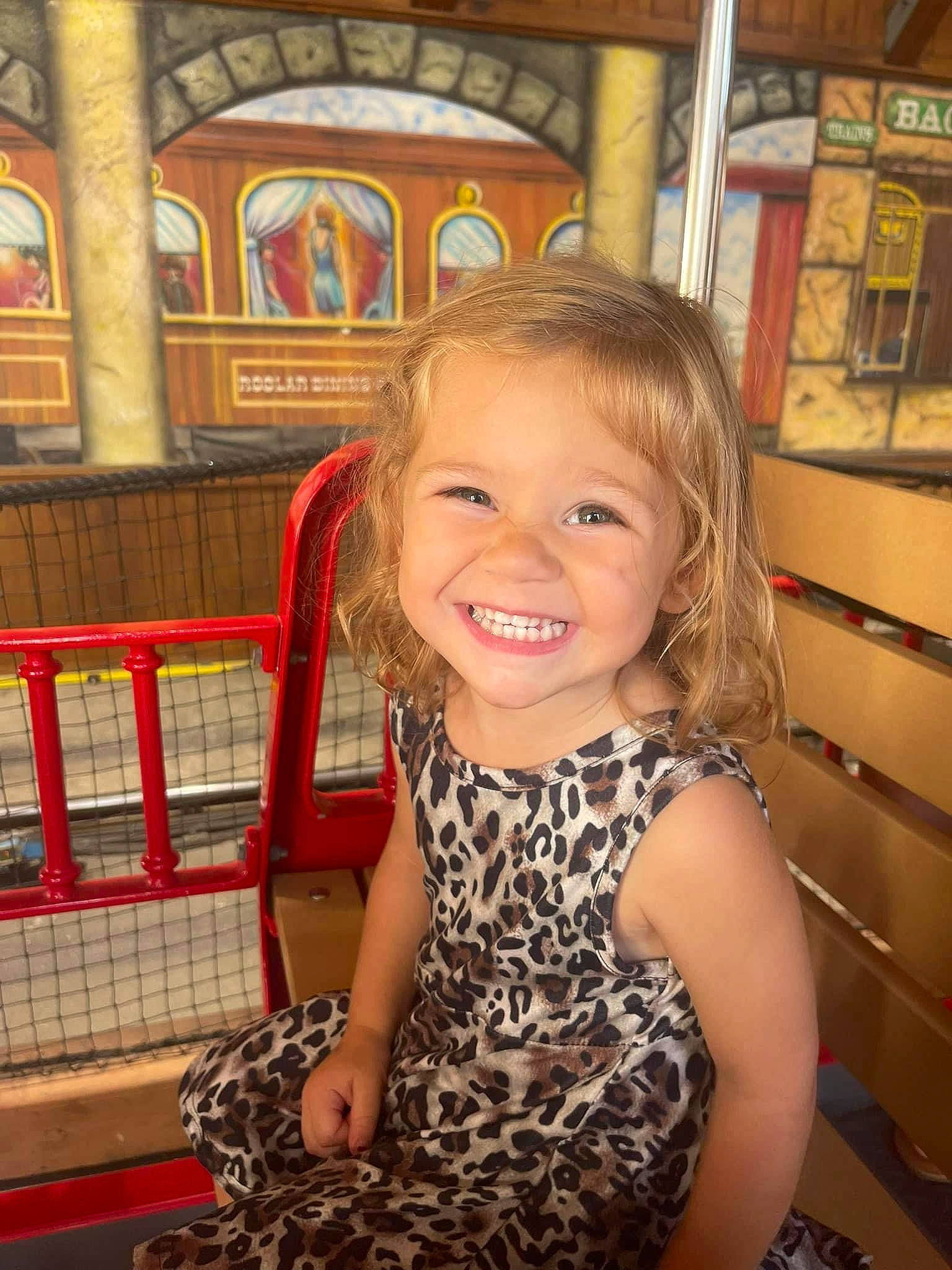 Lillian is registered to the contest to win money with this photo: blond, brown_hair, child, fun, hairstyle, happy, human_body, iris, joy, leisure, organ, people, person, room, shoulder, sitting, skin, smile, thigh, toddler