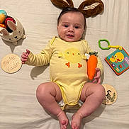 Samuil is registered to the contest to win money with this photo: applique, baby, bodypart, couch, cushion, diaper, face, finger, furniture, hand, head, homedecor, newborn, pattern, person, photography, plush, portrait, sitting, toy