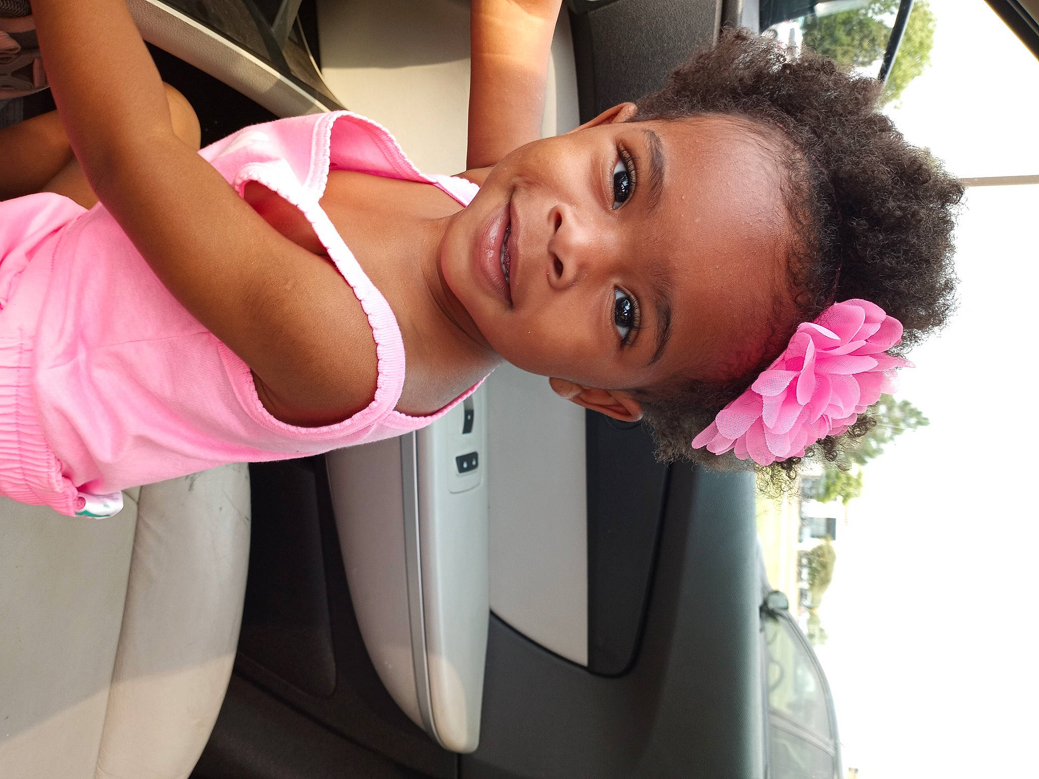 Reign Aylani is registered to the contest to win money with this photo: beauty, black_hair, car, dress, eyebrow, eyelash, flower, happy, joy, lip, long_hair, magenta, mouth, person, petal, pink, plant, shoulder, skin, vehicle_door