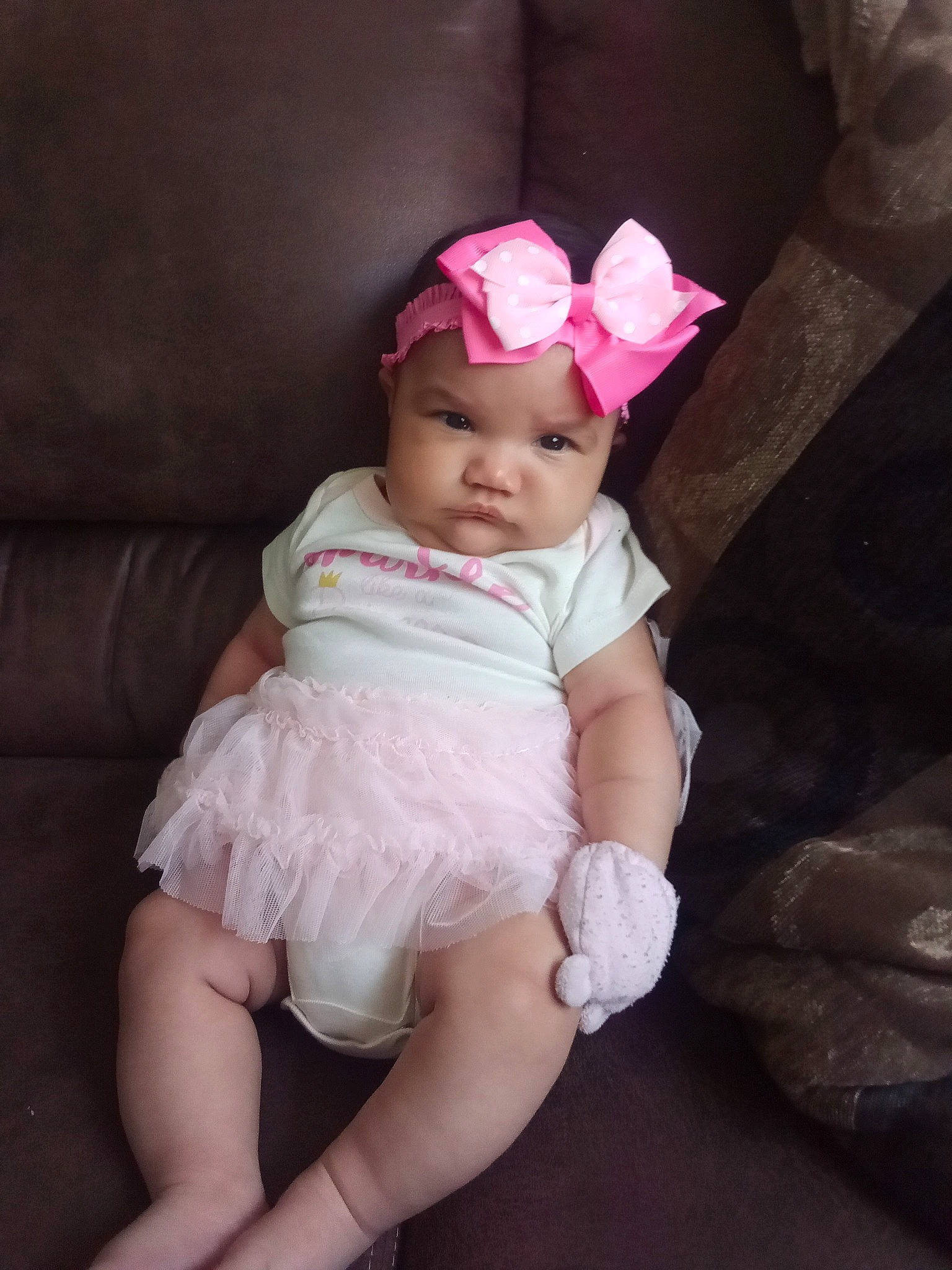 Jaylynn is registered to the contest to win money with this photo: baby, baby_toddler_clothing, cheek, dress, embellishment, eye, face, flash_photography, happy, head, headband, headgear, headpiece, headwear, lip, person, petal, pink, purple, skin