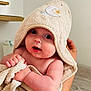 arm, baby, blanket, child, cozy, curious, cute, expression, face, hand, holding, hood, indoor, infant, newborn, person, skin, soft, towel, wrapped
