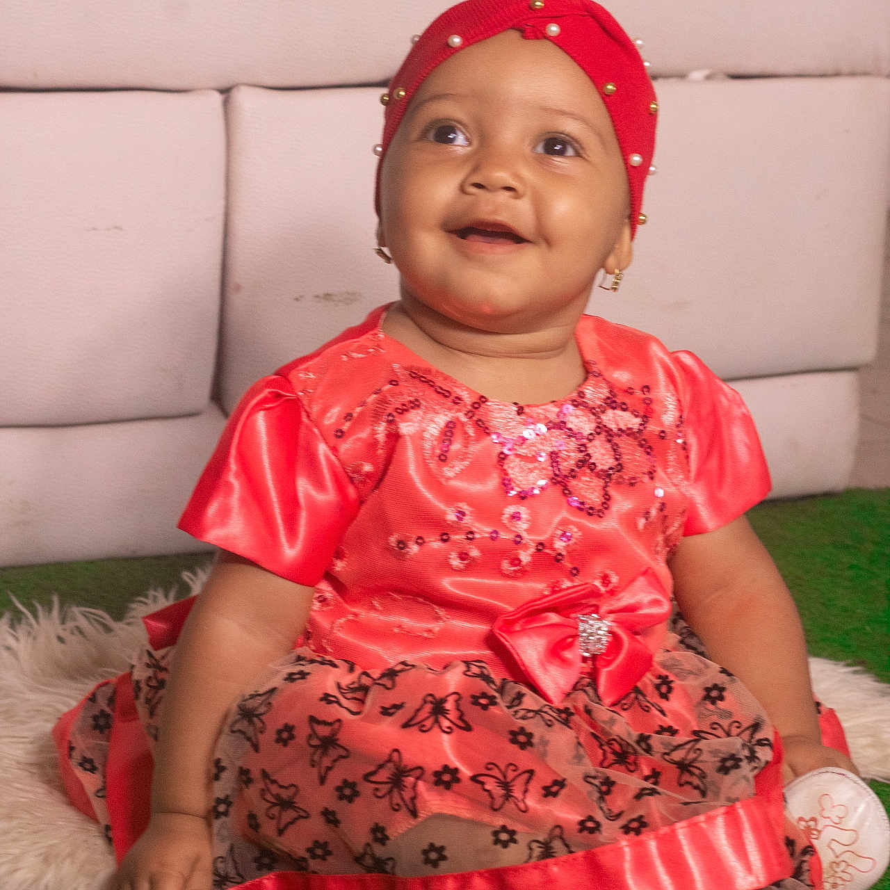 Ioana is registered to the contest to win money with this photo: baby, butterfly, carpet, child, coral_color, cute, dress, earring, fabric, green, happy, headband, indoor, pattern, pearl, portrait, sitting, smiling, sparkle, white_rug