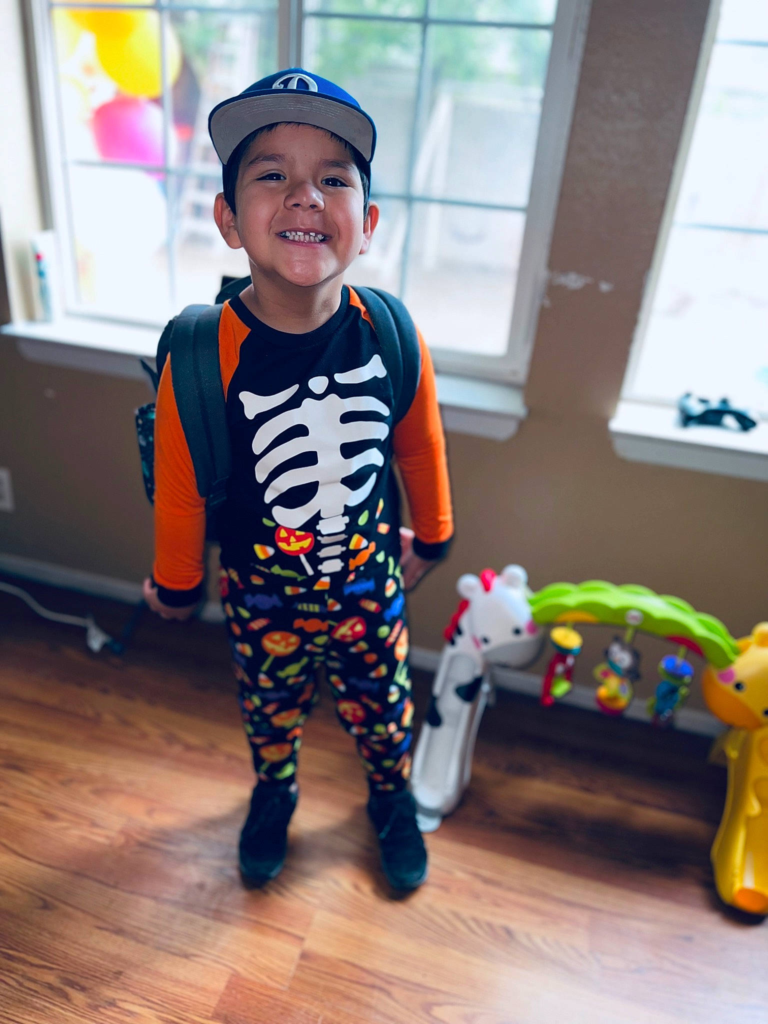 Cruzito is registered to the contest to win money with this photo: baby_toddler_clothing, baseball_cap, cap, child, electric_blue, eyewear, face, fashion_design, flooring, fun, happy, hat, headwear, joy, person, personal_protective_equipment, sleeve, smile, t_shirt, toddler