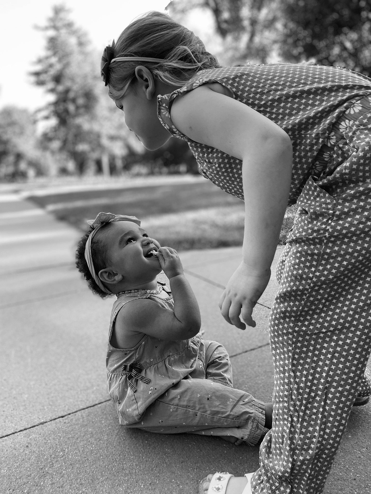 Aria is registered to the contest to win money with this photo: arm, black, black_and_white, child, family, fun, hand, happy, interaction, monochrome, monochrome_photography, people, person, photograph, photography, sitting, smile, snapshot, stock_photography, toddler