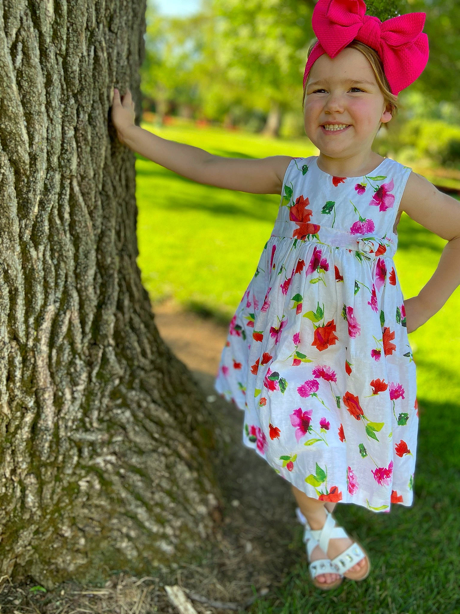 Amellia is registered to the contest to win money with this photo: baby_toddler_clothing, branch, child, child_model, clothing, dress, grass, green, headgear, headwear, joy, leaf, pattern, person, pink, plant, spring, textile, toddler, tree