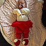 baby, infant, pacifier, blanket, red_clothing, tutu, booties, sleepy, indoors, cute, child, soft_texture, person, lying_down, holiday_theme, cozy, warm, newborn, comfort, resting