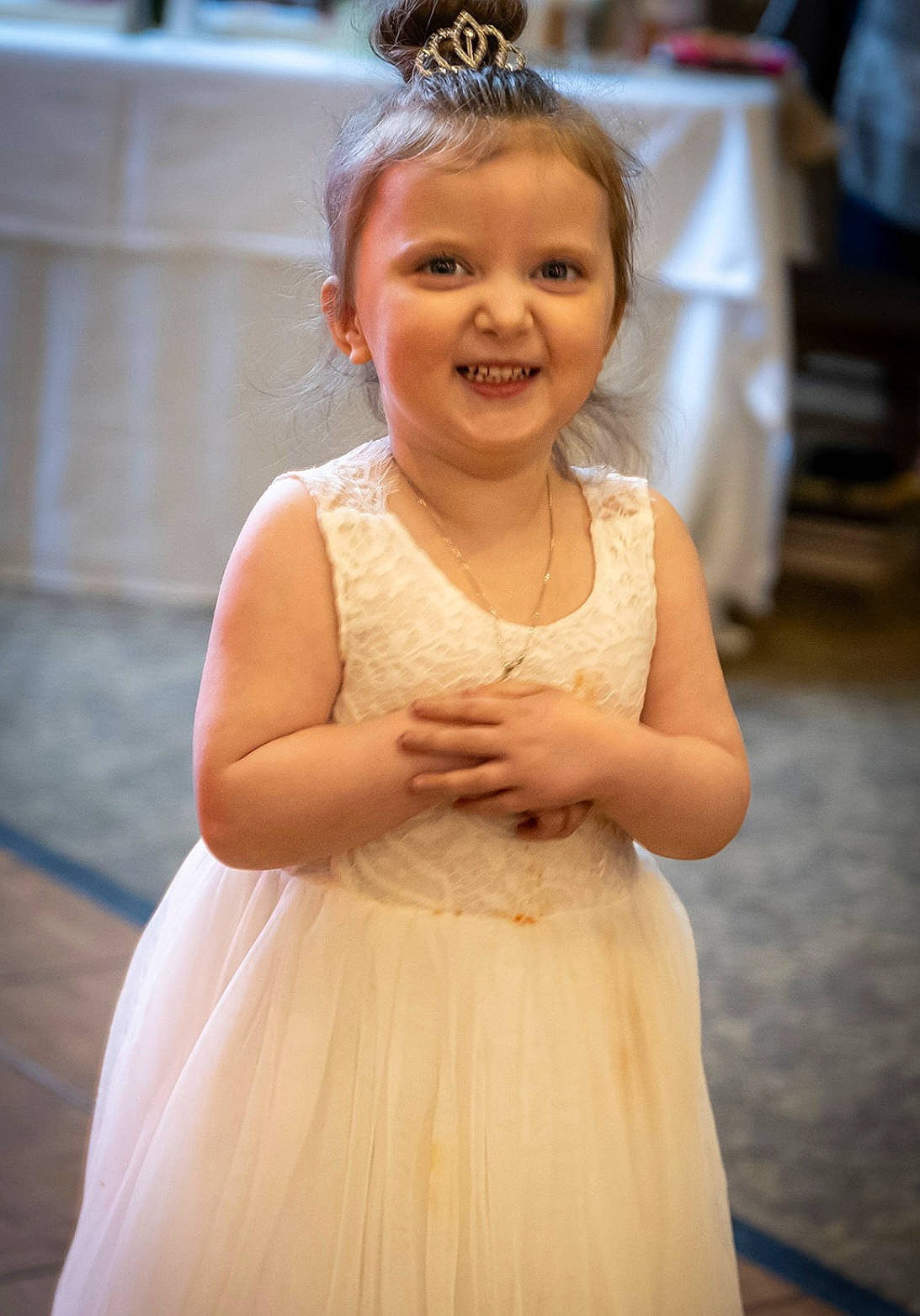 Sophia is registered to the contest to win money with this photo: bridal_accessory, bridal_clothing, child, day_dress, dress, embellishment, facial_expression, gown, hair, hairstyle, happy, iris, joy, one_piece_garment, person, photograph, pink, skin, smile, toddler