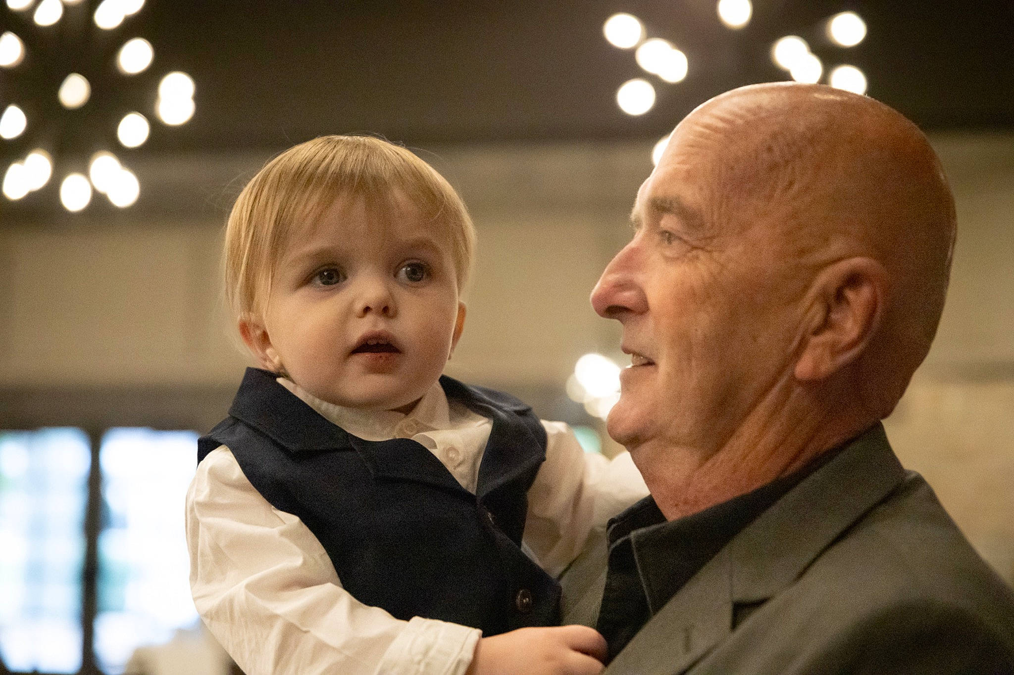 Lachlan joined the competition — help win amazing prizes! baby, ceremony, child, christmas, conversation, event, family, flash_photography, formal_wear, fun, gesture, happy, holiday, person, standing, suit, toddler