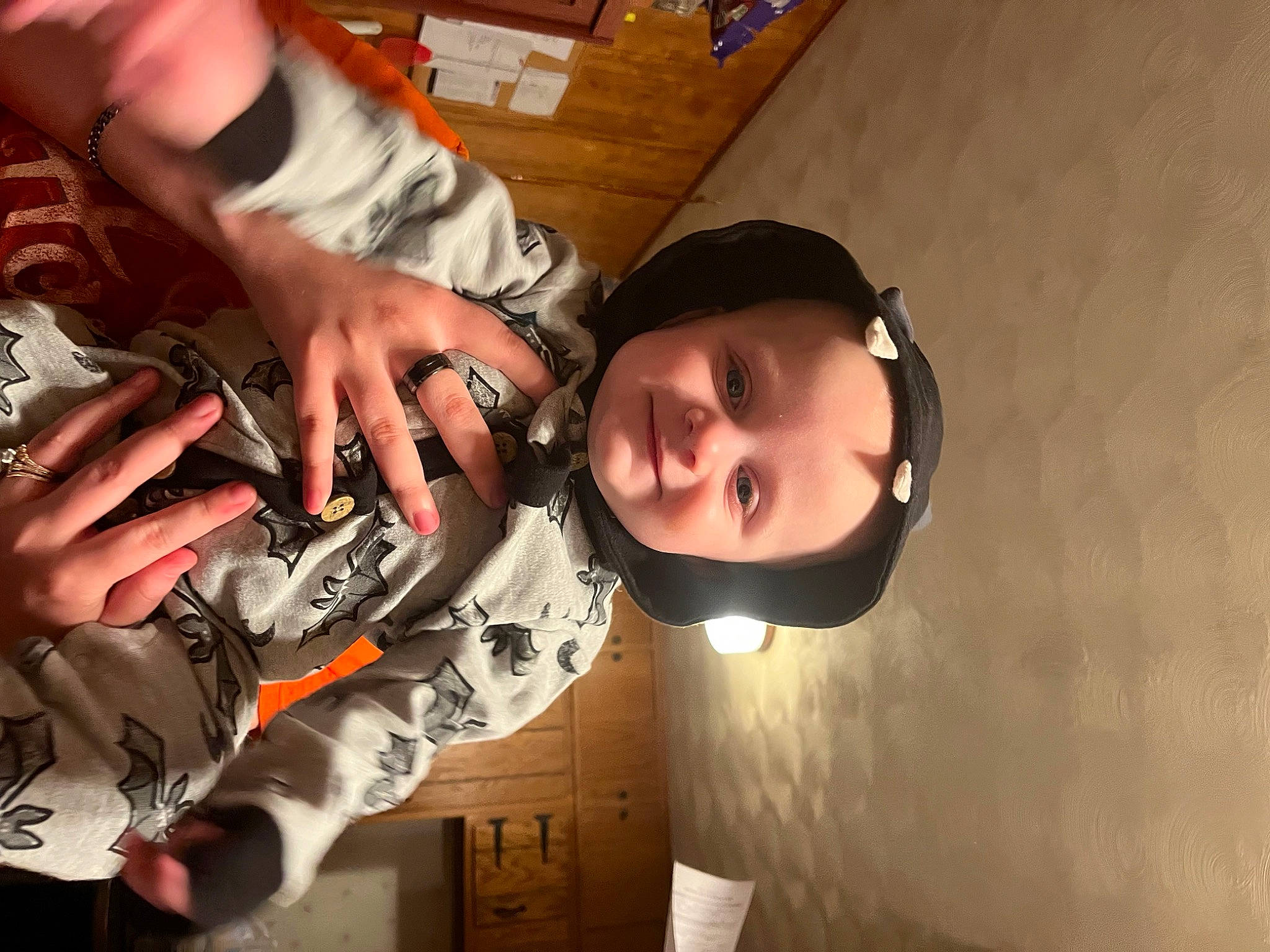 Declan is registered to the contest to win money with this photo: bangs, carmine, child, elbow, eyelash, eyewear, fashion_accessory, flash_photography, flesh, fun, gesture, joy, nail, person, personal_protective_equipment, sleeve, thumb, wood, wrist