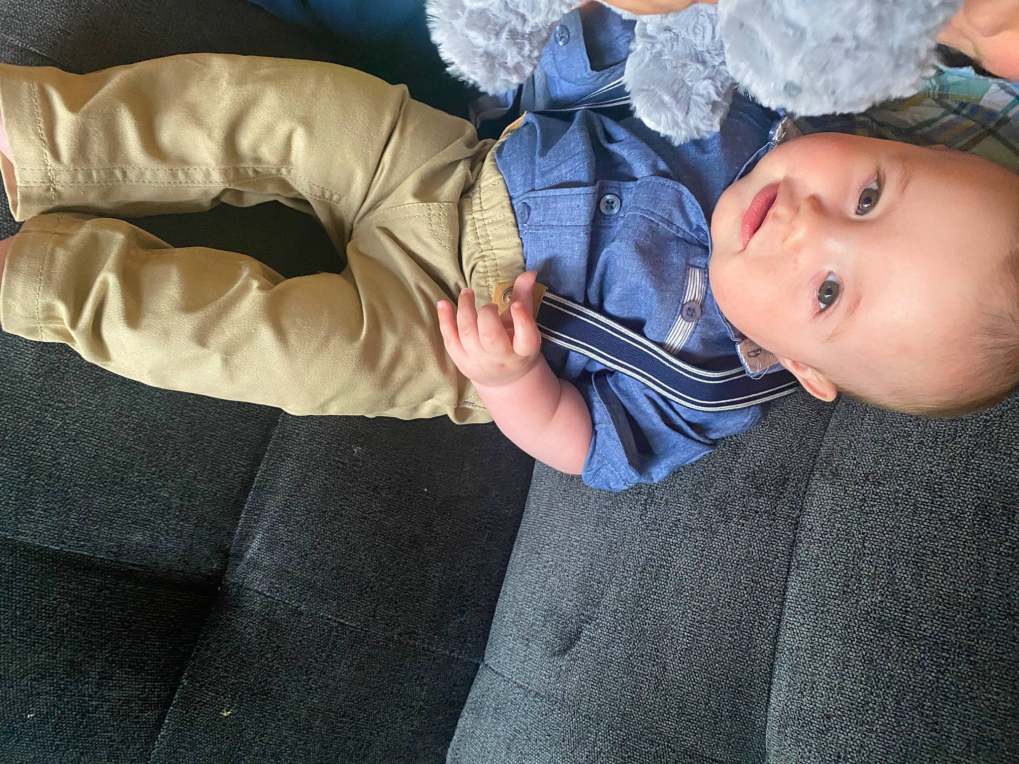 Arian is registered to the contest to win money with this photo: baby, baby_products, baby_toddler_clothing, child, comfort, denim, elbow, electric_blue, fashion_accessory, finger, gesture, grass, happy, nail, person, sitting, sleeve, thumb, toddler, tree