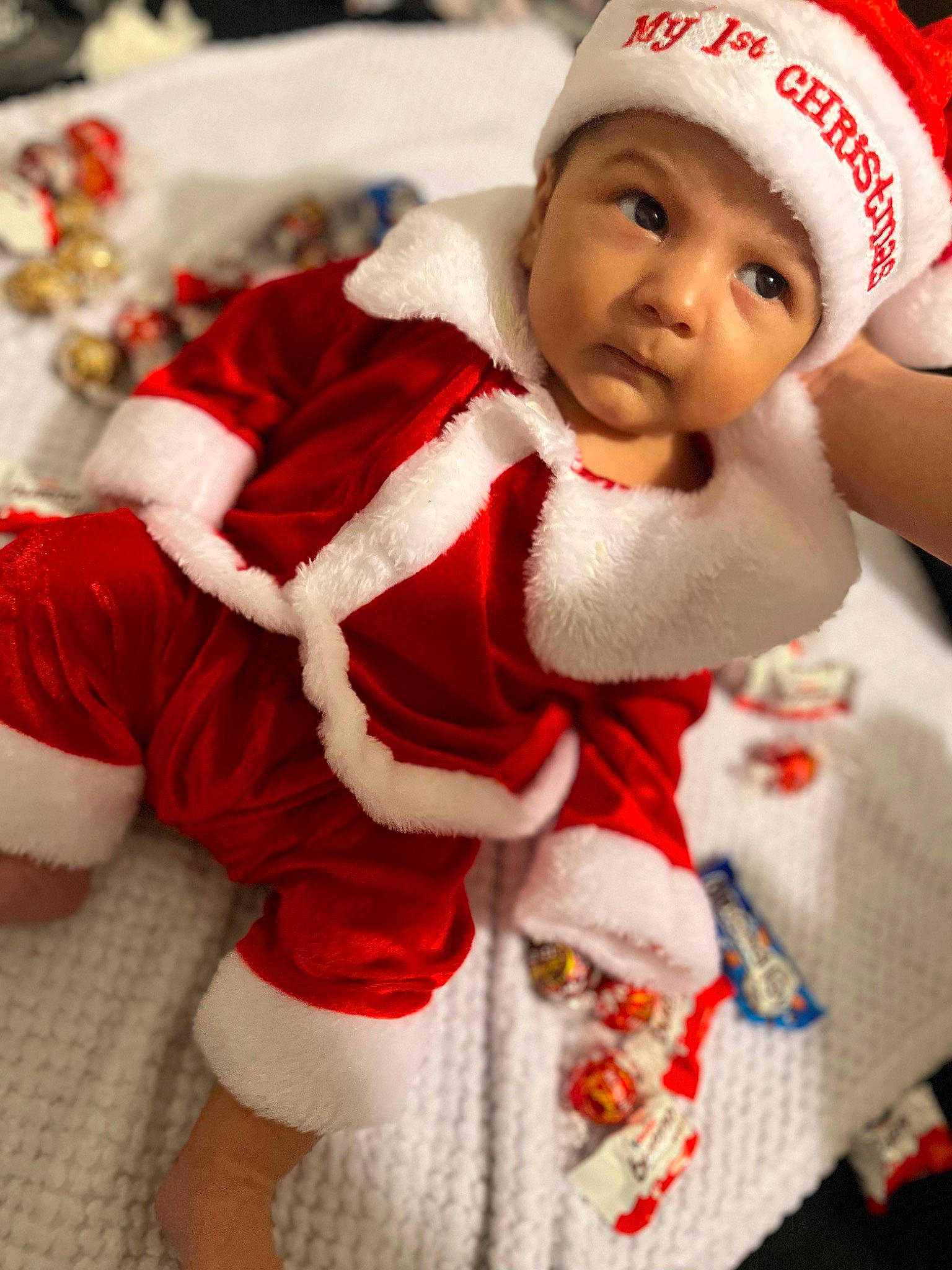 Iosua Jonathan is registered to the contest to win money with this photo: baby, baby_toddler_clothing, cap, christmas, christmas_eve, event, eye, face, fictional_character, fur, happy, head, headgear, headwear, holiday, human_body, person, red, santa_claus, sleeve