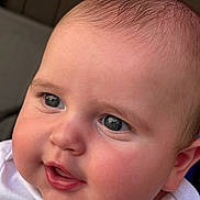 Damon Jiménez Romeu joined the competition — help win amazing prizes! baby, closeup, face, child, infant, cute, skin, eyes, cheeks, expression, portrait, head, hair, white_clothing, blue, young, adorable, people, person, soft_light