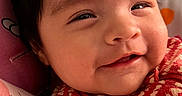 Valentina joined the competition — help win amazing prizes! baby, blanket, child, closeup, cozy, cute, expression, face, happy, head, heart_pattern, indoors, infant, portrait, red_clothing, resting, smiling, soft_toys, warm_colors, young_child
