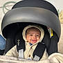 Lorenzo a rejoint le concours — aidez-le/la à gagner de superbes lots ! baby, blanket, button, car_seat, child, closeup, clothing, cozy, cute, face, happy, hooded_jacket, indoor, infant, infant_car_seat, person, portrait, safety, seatbelt, smiling