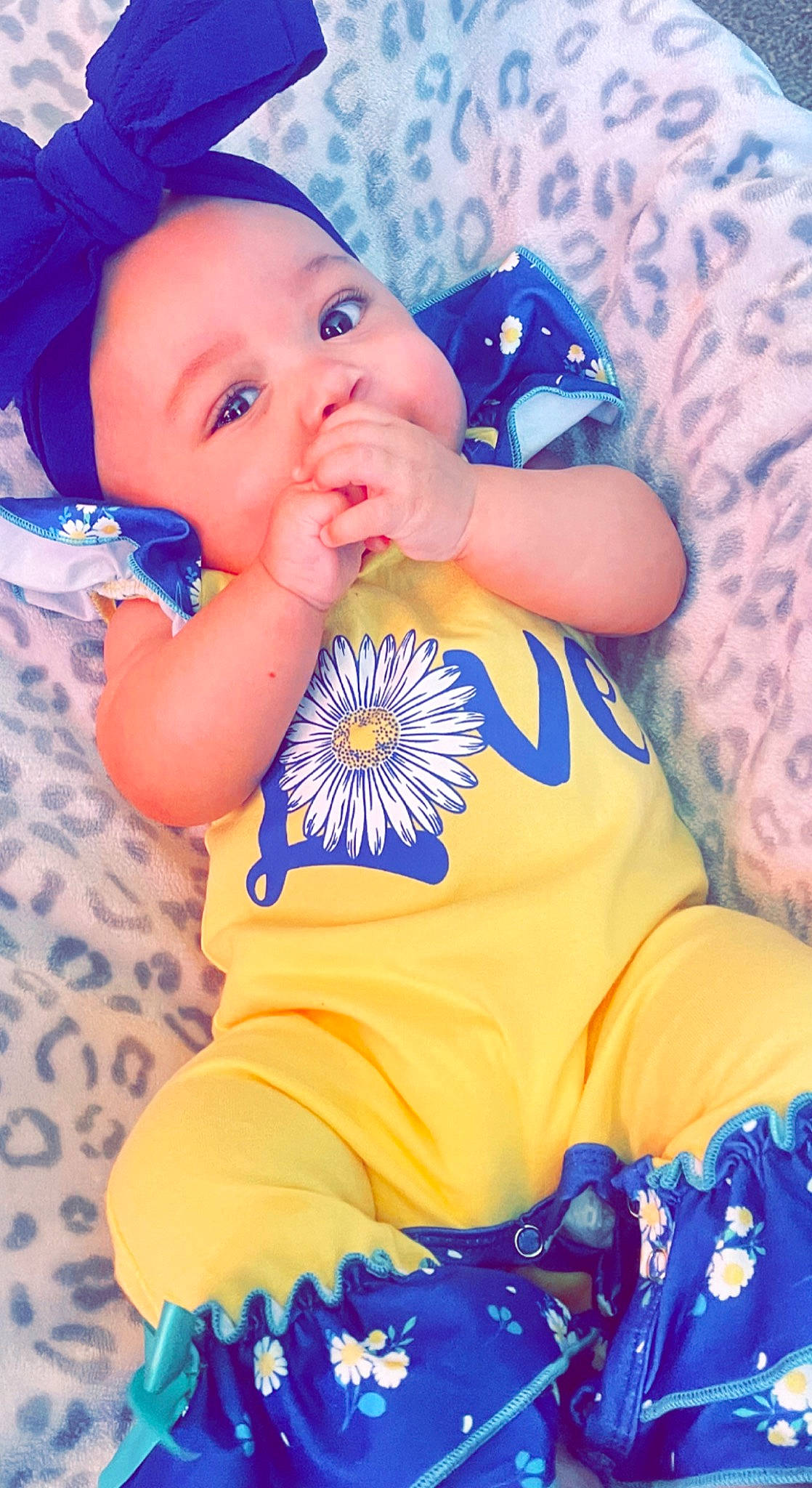 Anaya is registered to the contest to win money with this photo: arm, azure, baby, baby_products, baby_toddler_clothing, blue, cheek, child, electric_blue, eye, face, happy, headwear, iris, nail, pattern, person, skin, sleeve, smile
