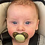 baby, blue_eyes, car_seat, child, close-up, clothing, curious, expression, face, hand, head, indoor, infant, pacifier, person, portrait, seatbelt, skin, straps, young_child
