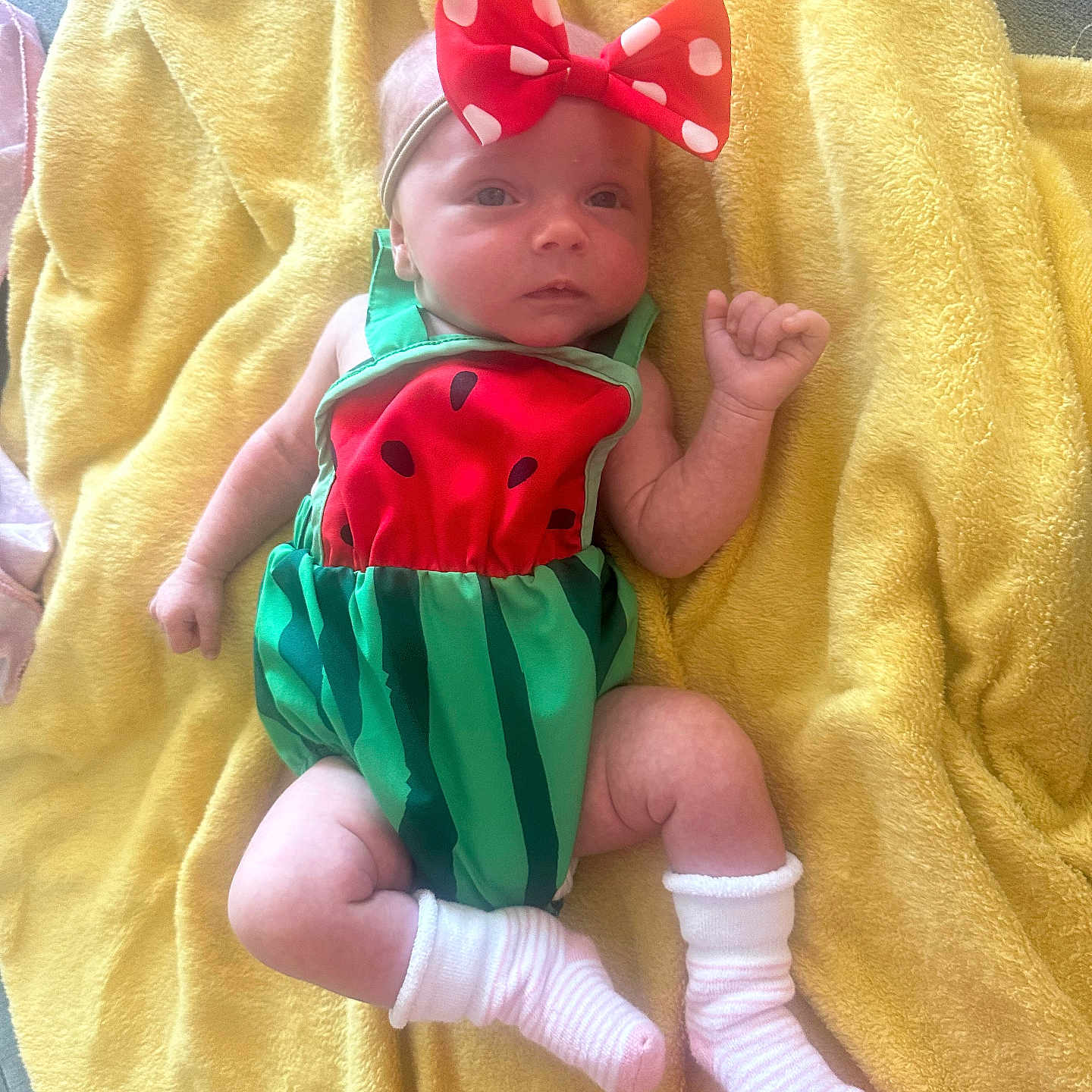 Layla is registered to the contest to win money with this photo: accessories, baby, bed, blanket, clothing, costume, dress, face, formalwear, furniture, head, hosiery, newborn, person, photography, portrait, quilt, sock, tie, towel