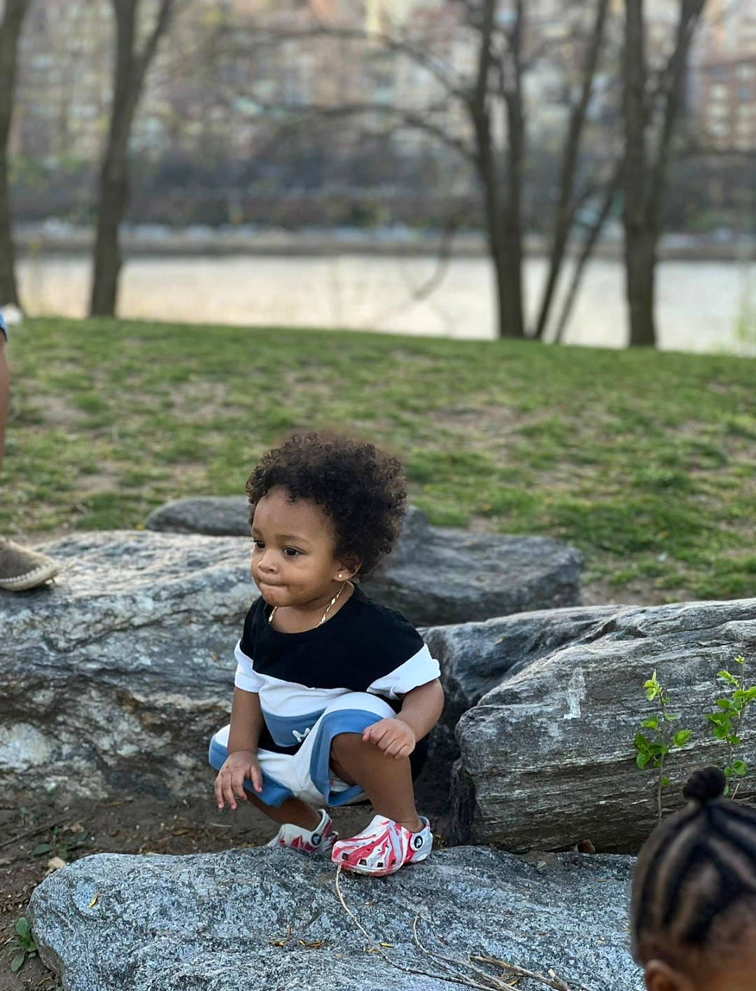 Josiah is registered to the contest to win money with this photo: child, eye, fun, grass, hairstyle, happy, head, leaf, leisure, mammal, people_in_nature, person, plant, public_space, recreation, summer, toddler, tree, vertebrate, wood