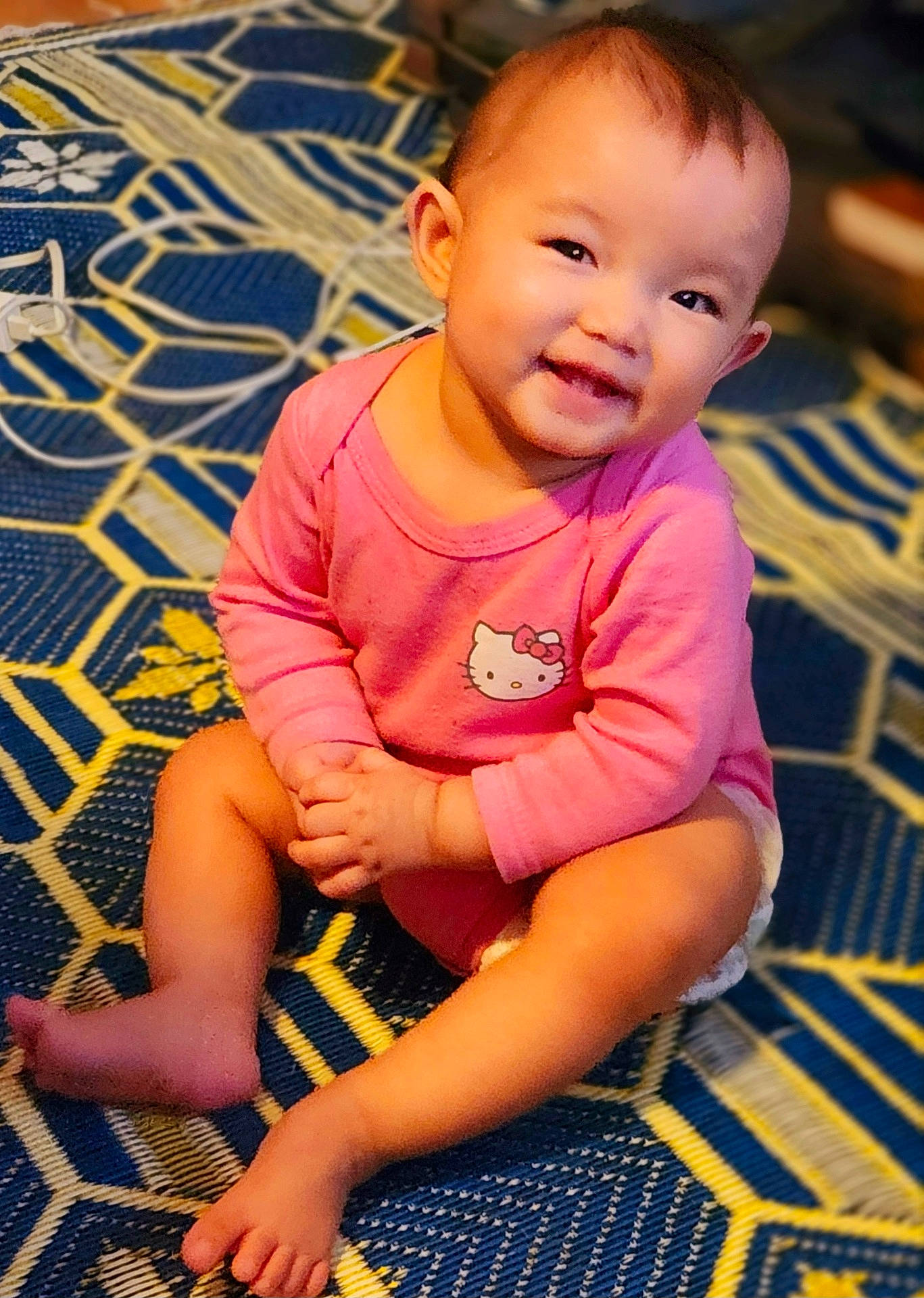 baby, ball, bodypart, clothing, face, finger, football, hand, happy, head, homedecor, pants, person, photography, portrait, shorts, sitting, smile, soccer, t_shirt