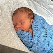 Archer joined the competition — help win amazing prizes! newborn, baby, sleeping, blue_blanket, knitted_blanket, white_towel, cozy, infant, peaceful, soft_texture, wrapped, portrait, child, cute, resting, indoors, closeup, tiny_hands, face, head