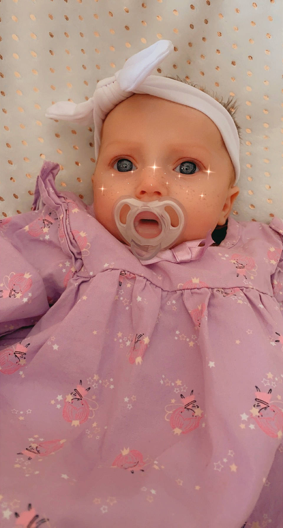 Addisyn is registered to the contest to win money with this photo: baby, cheek, child, chin, doll, dress, eye, eyebrow, eyelash, happy, head, headwear, iris, lip, mouth, nose, peach, person, pink, skin