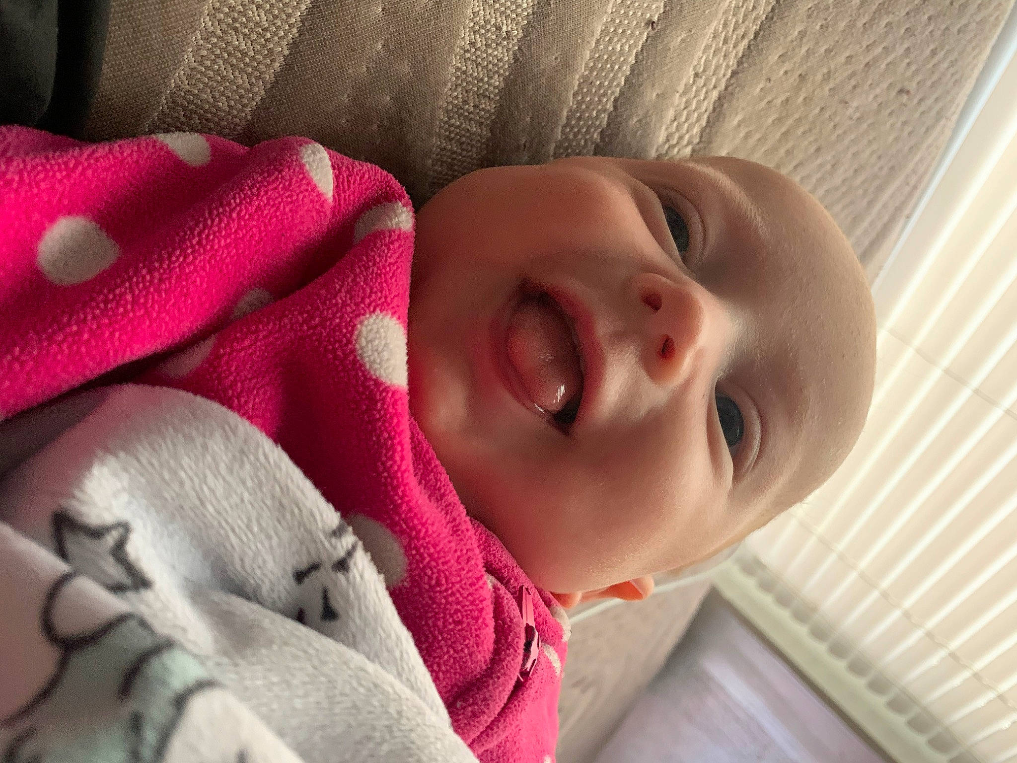 Addisyn is registered to the contest to win money with this photo: baby, baby_toddler_clothing, cheek, chin, comfort, eye, eyebrow, head, iris, linens, lip, mouth, nose, person, pink, product, skin, smile, textile, toddler