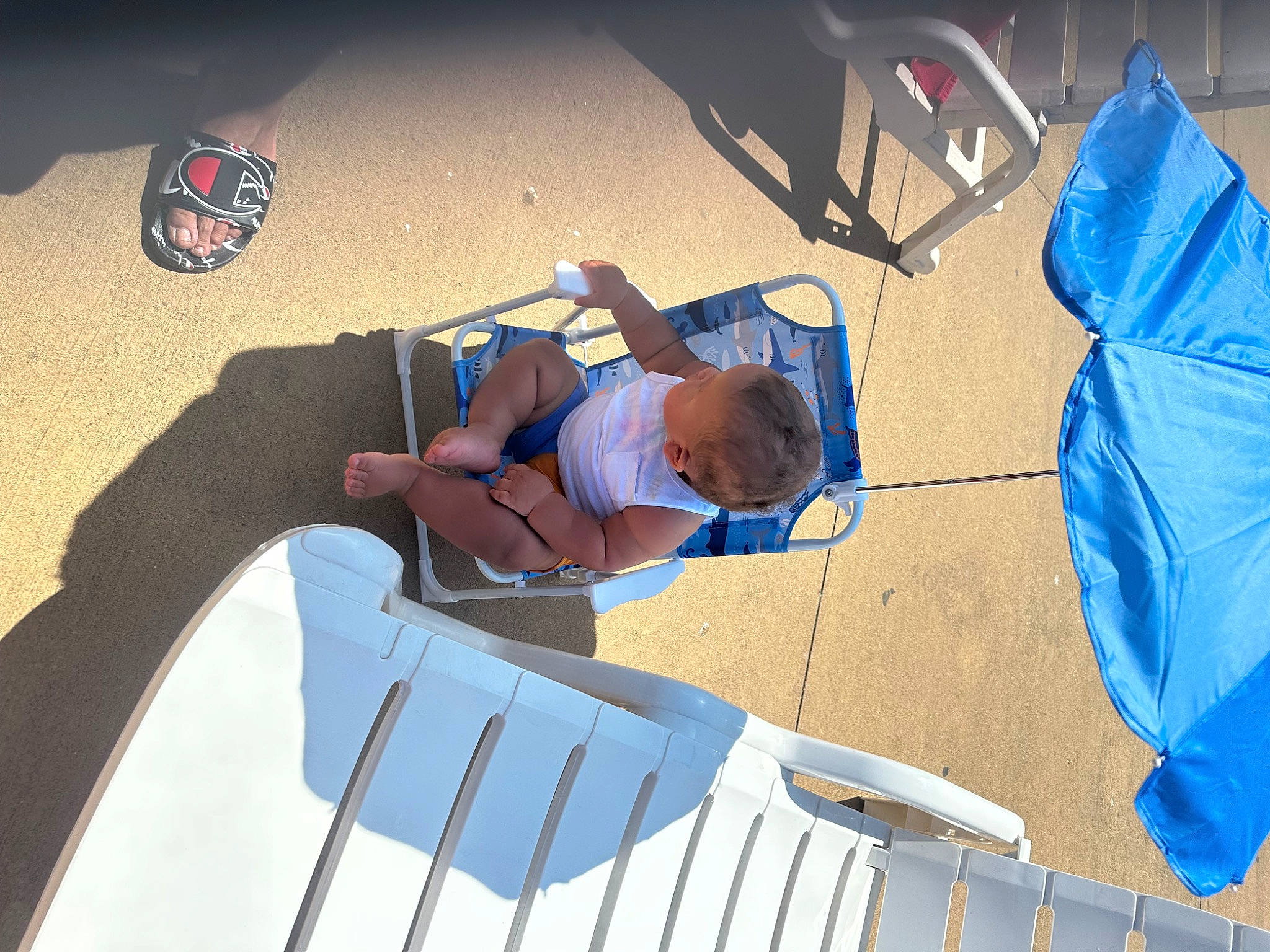 Jamal joined the competition — help win amazing prizes! blue, comfort, elbow, electric_blue, fun, hat, human_leg, leisure, person, sand, shade, shadow, shorts, sitting, t_shirt, tints_and_shades, toddler, travel, vacation