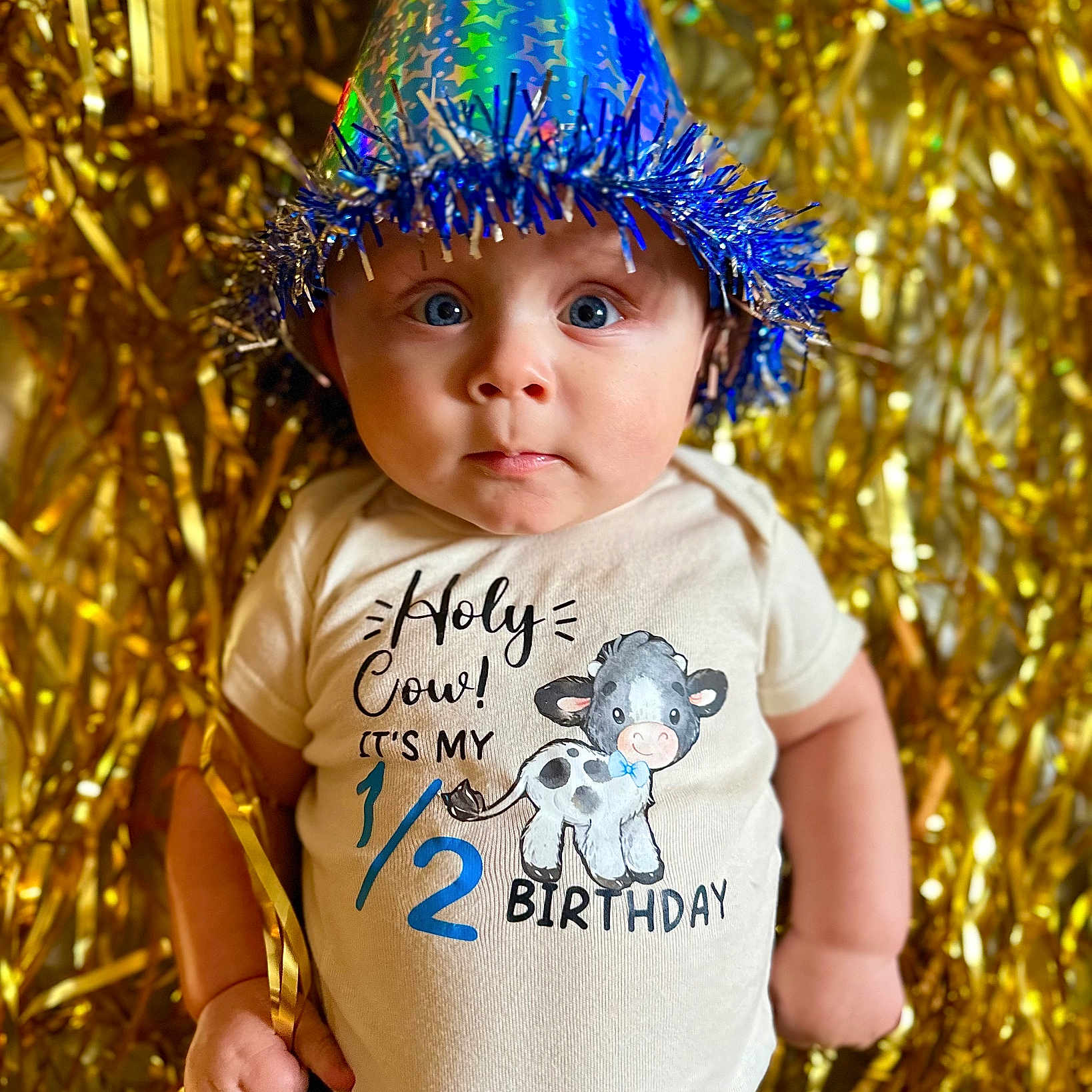 Hayden is registered to the contest to win money with this photo: baby, bonnet, cap, carnival, clothing, costume, face, hair, hat, head, hood, pants, parade, partyhat, people, person, photography, portrait, purple, t_shirt