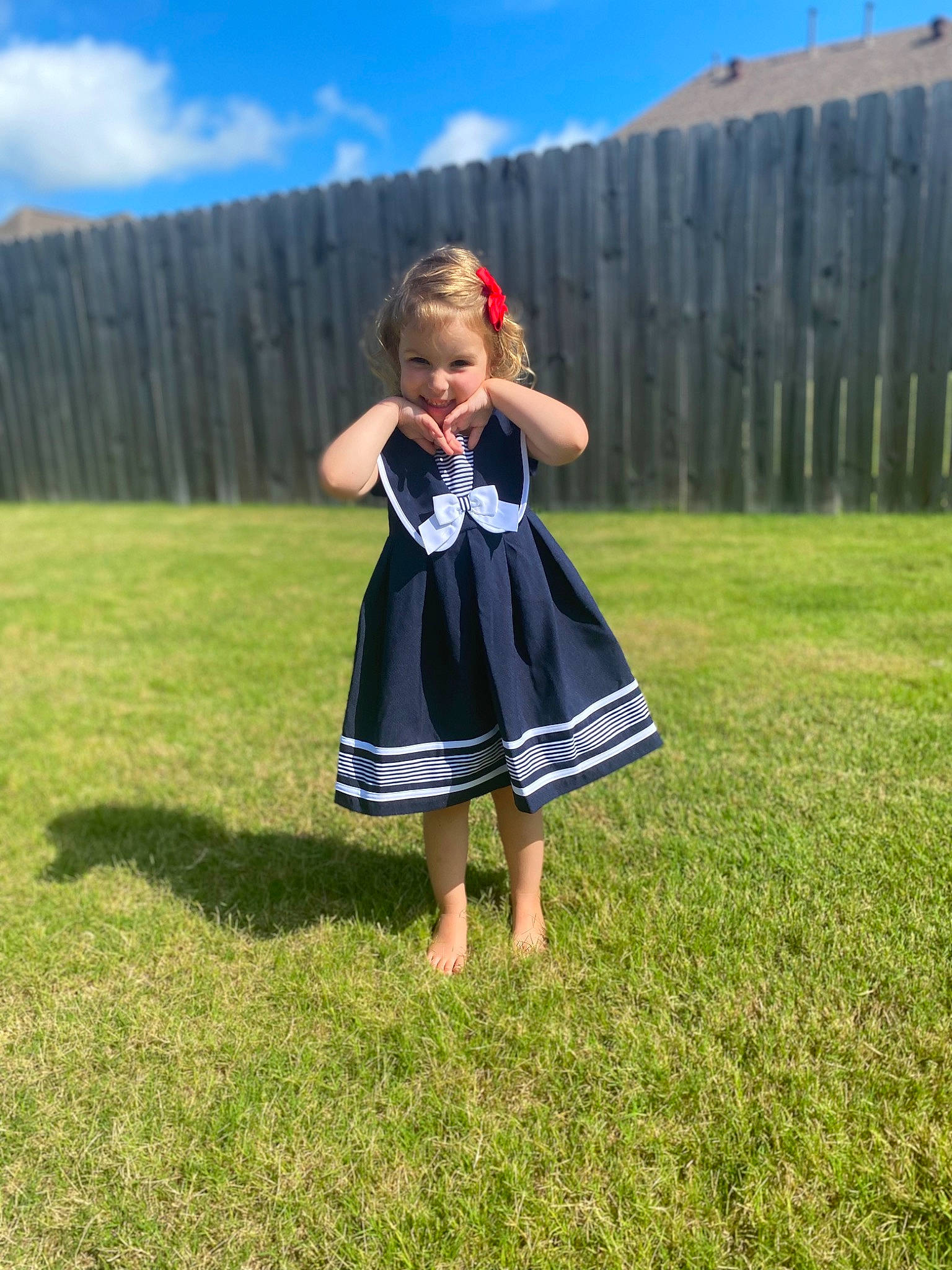 Amelia is registered to the contest to win money with this photo: baby_toddler_clothing, cloud, day_dress, dress, electric_blue, fence, fun, grass, grass_family, grassland, happy, lawn, leisure, meadow, pattern, people_in_nature, person, sky, summer, toddler