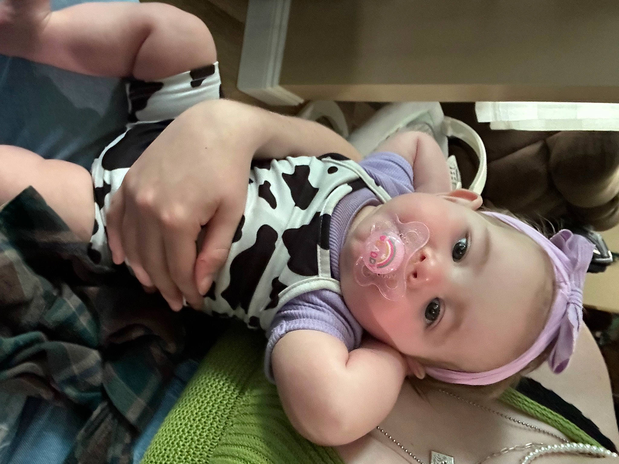 Ezra is registered to the contest to win money with this photo: abdomen, baby, baby_products, baby_toddler_clothing, blond, chest, child, comfort, elbow, eyelash, eyewear, fashion_accessory, happy, jewellery, person, personal_protective_equipment, room, sitting, sunglasses, thigh