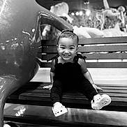 Halo-Rose joined the competition — help win amazing prizes! toddler, child, smile, bench, shoes, bow, black_and_white, indoor, sculpture, playful, happy, person, portrait, wooden_bench, lighting, cute, sitting, clothing, fashion, baby