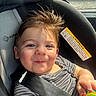 Thomas is registered to the contest to win money with this photo: baby, car, car_seat, child, closeup, cute, hair, happy, indoors, person, playful, portrait, safety_belt, seat, seatbelt, smile, striped_clothing, sunlight, toddler, toy