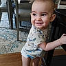 Raylan joined the competition — help win amazing prizes! baby, carpet, chair, child, clothing, cute, diaper, face, floor, happy, home, indoor, onesie, person, room, smiling, standing, table, toddler, wooden_furniture