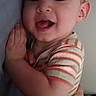 Raylan joined the competition — help win amazing prizes! baby, child, smiling, tongue_out, striped_shirt, face, hand, arm, person, infant, closeup, cute, happy, portrait, skin, head, young, holding, indoor, expression