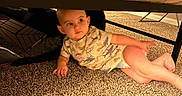 Raylan is registered to the contest to win money with this photo: toddler, child, carpet, bed, indoor, curious, crawling, clothing, baby, floor, furniture, home, young_child, person, cute, exploring, casual, resting, infant, cozy