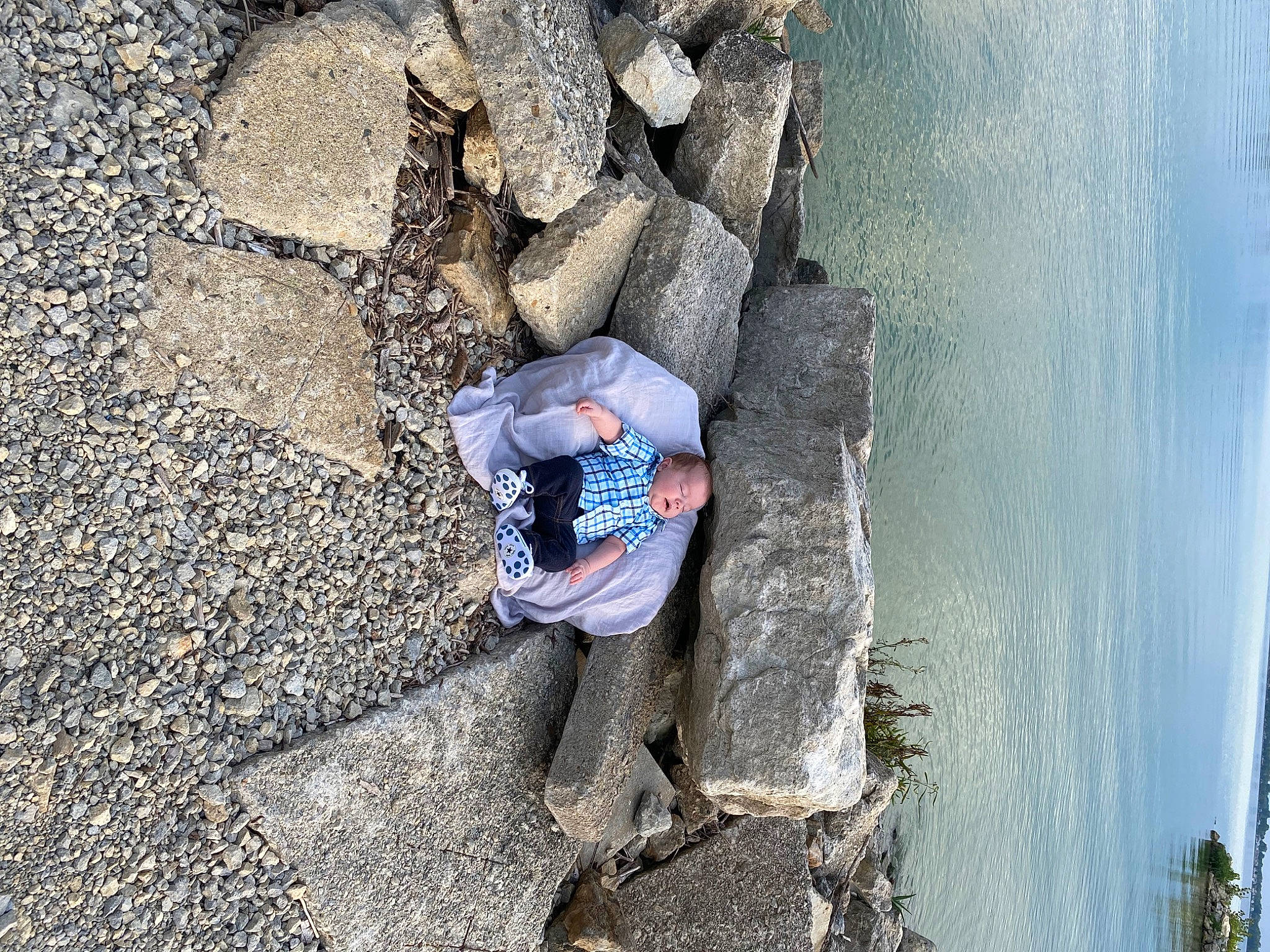 Cohen is registered to the contest to win money with this photo: adventure, bedrock, coast, denim, formation, fun, geological_phenomenon, geology, lake, leisure, ocean, outcrop, person, plant, recreation, rock, sky, soil, wall, water